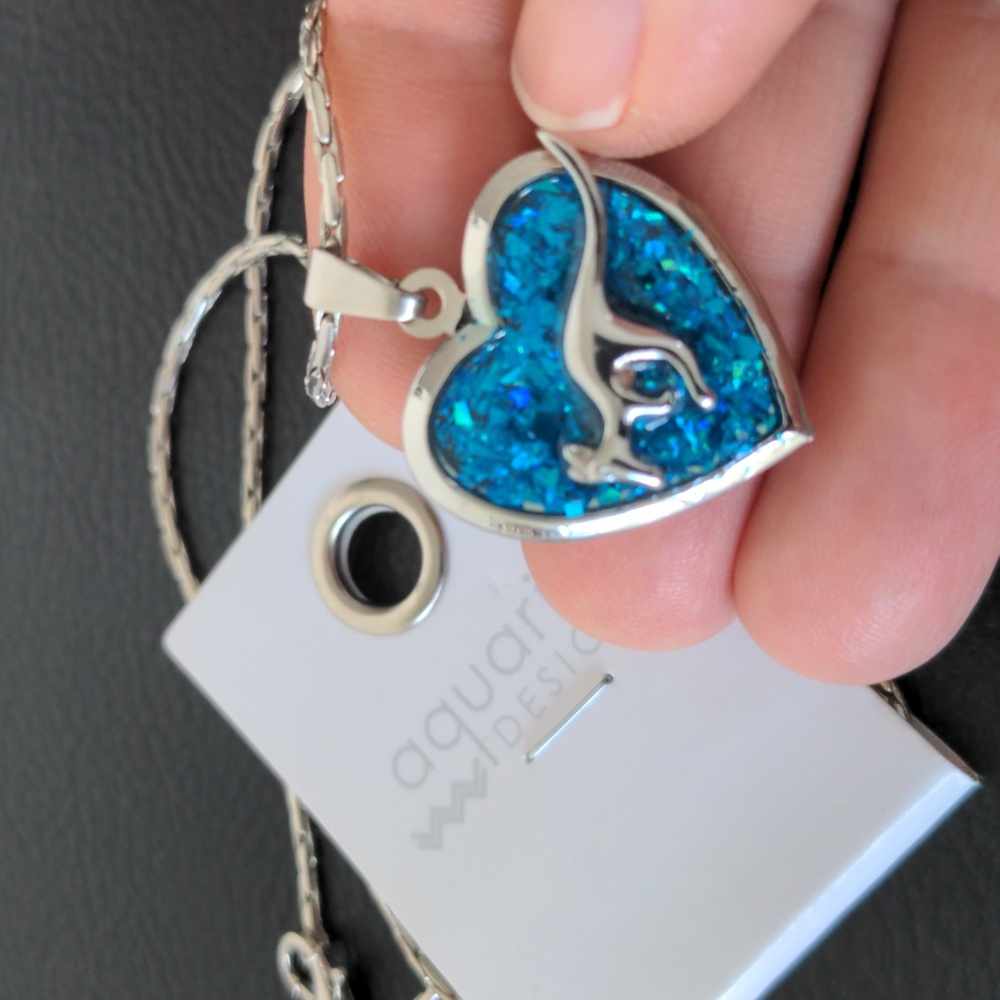 New silver tone heart shaped locket necklace w opal-like enamel and kangaroo